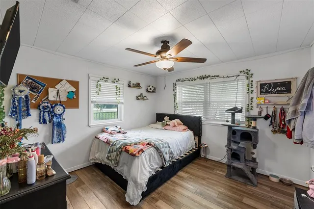 a bedroom that has a bed and a chandelier