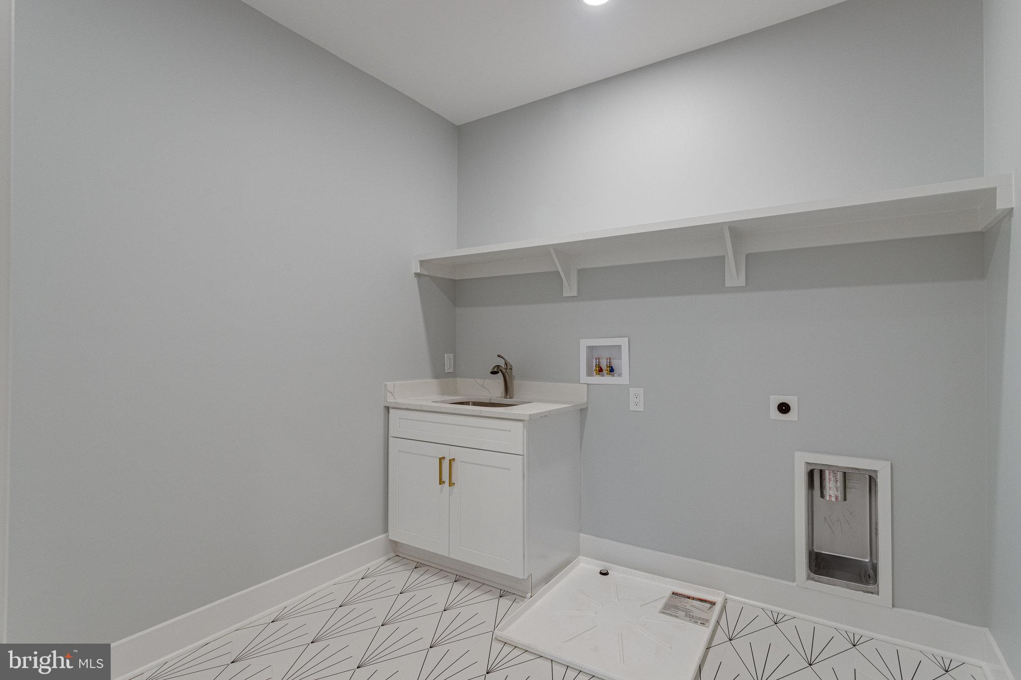 1952 Foxhall Road McLean, VA 22101 - Photo 70 of 99 Built in cabinetry with utility sink and faucet