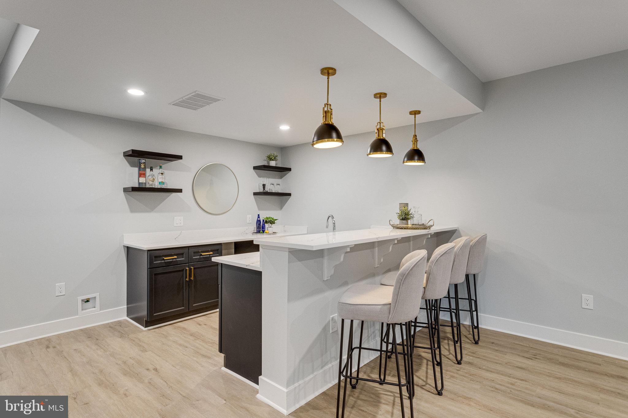 1952 Foxhall Road McLean, VA 22101 - Photo 73 of 99 Wet bar base cabinets and quartz countertop