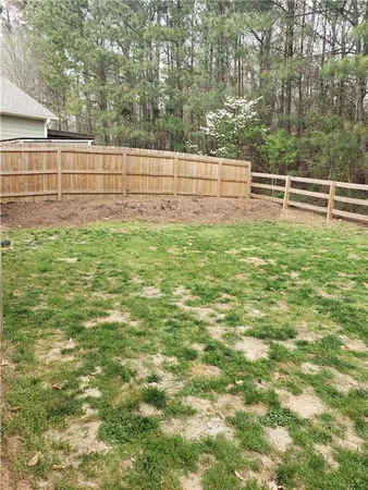 a view of outdoor space with deck and yard
