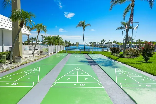 a view of swimming pool with a patio and a yard