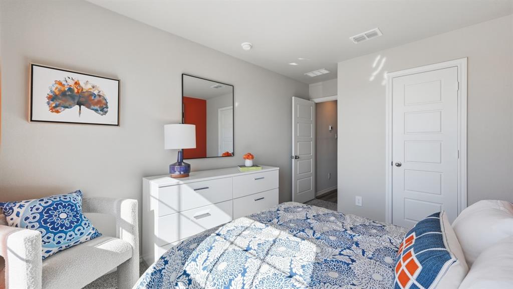 16428 Hudson Pr Way Justin, TX 76247 - Photo 30 of 39 a bedroom with a bed and a table in it