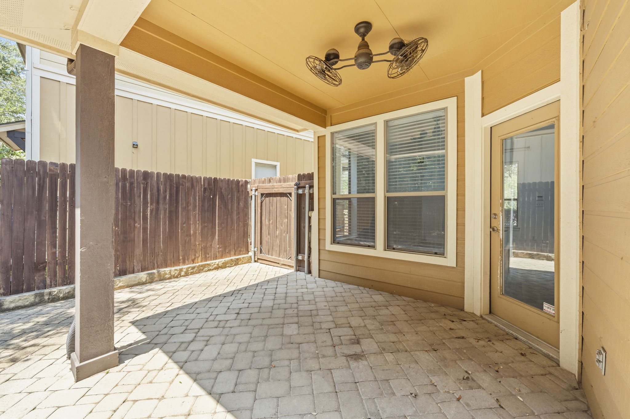 6708 Manchaca Road, Unit 4 Austin, TX 78745 - Photo 22 of 25 A covered back patio with interlocking stone pavers offers a private outdoor retreat.