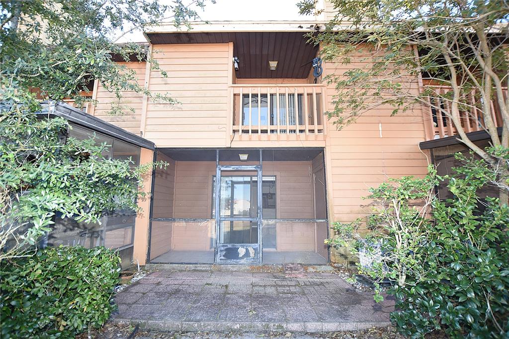 707 Carpenters Way, Unit 45 Lakeland, FL 33809 - Photo 19 of 20 front view of a house with a yard