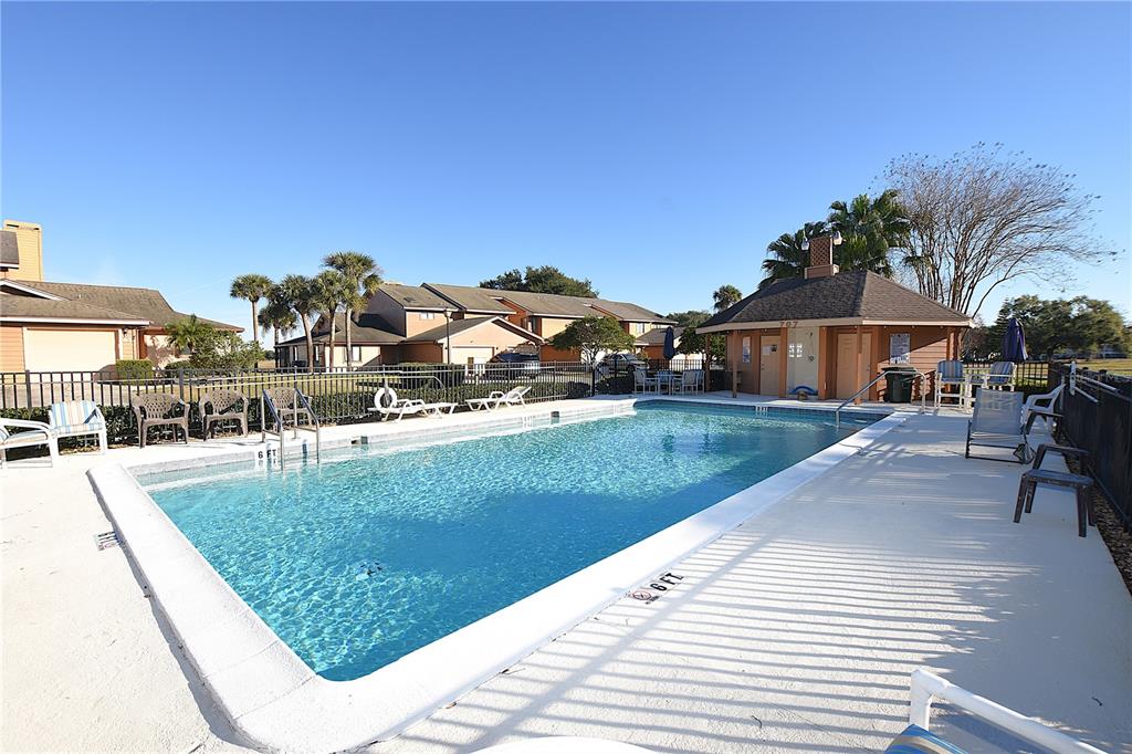 707 Carpenters Way, Unit 45 Lakeland, FL 33809 - Photo 20 of 20 a view of a house with a yard