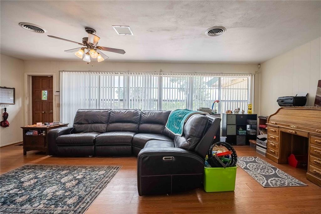5110 Lakeland Highlands Road Lakeland, FL 33813 - Photo 11 of 40 a living room with furniture fireplace and window