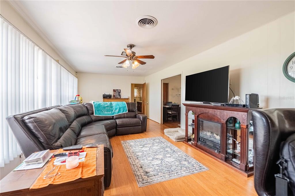5110 Lakeland Highlands Road Lakeland, FL 33813 - Photo 12 of 40 a living room with furniture and a flat screen tv