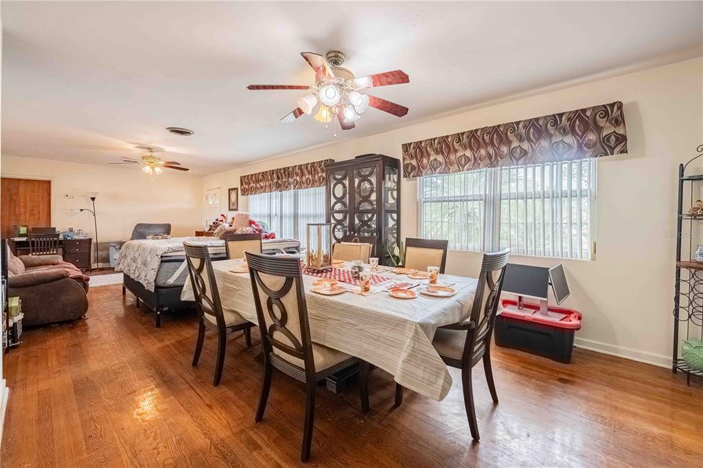 5110 Lakeland Highlands Road Lakeland, FL 33813 - Photo 25 of 40 a view of a dining room with furniture window and wooden floor