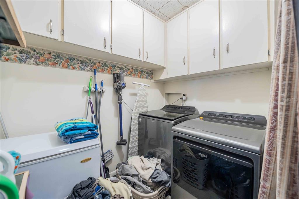 5110 Lakeland Highlands Road Lakeland, FL 33813 - Photo 31 of 40 a kitchen with stainless steel appliances a stove and a refrigerator