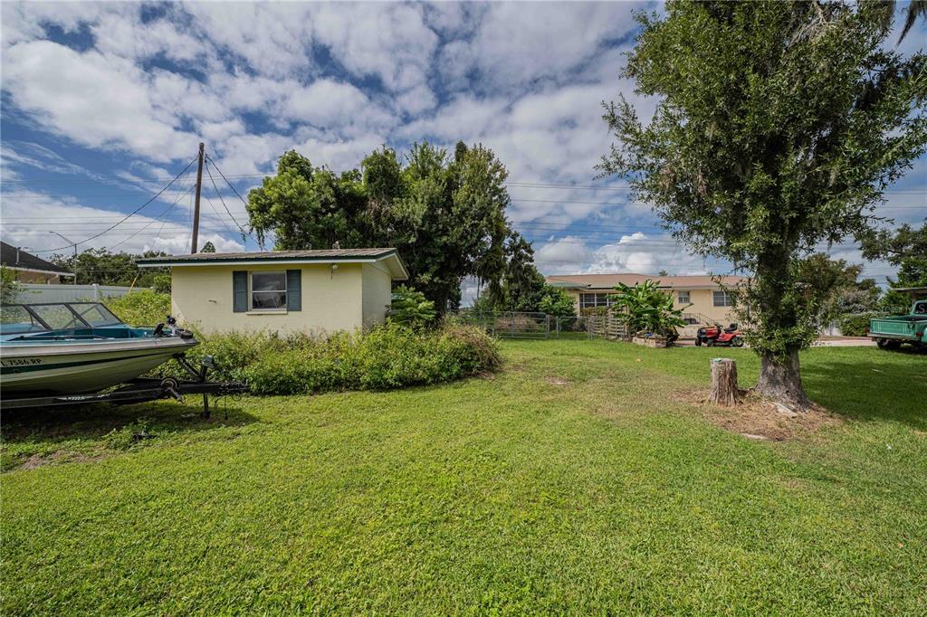 5110 Lakeland Highlands Road Lakeland, FL 33813 - Photo 5 of 40 a view of a backyard with plants and a patio