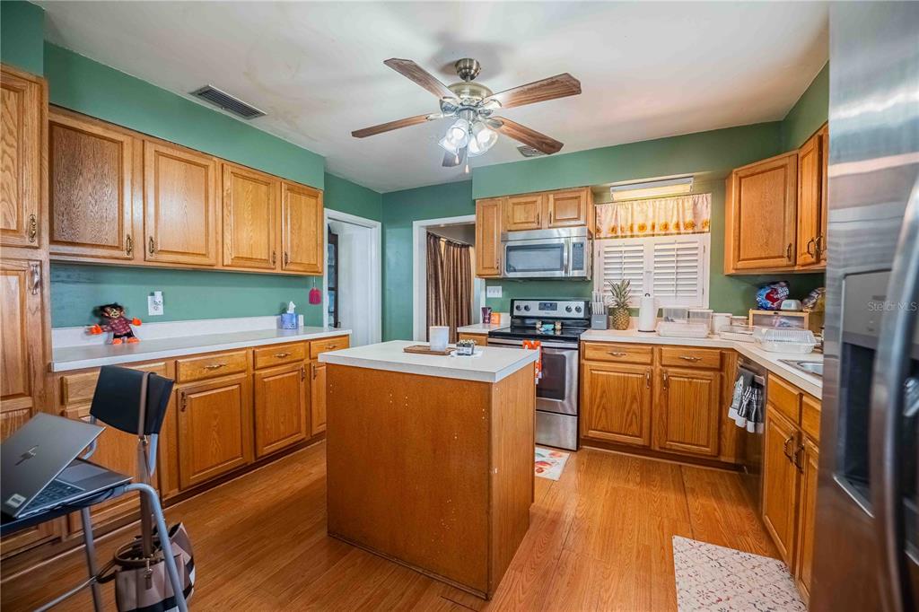 5110 Lakeland Highlands Road Lakeland, FL 33813 - Photo 6 of 40 a kitchen with cabinets a sink and appliances