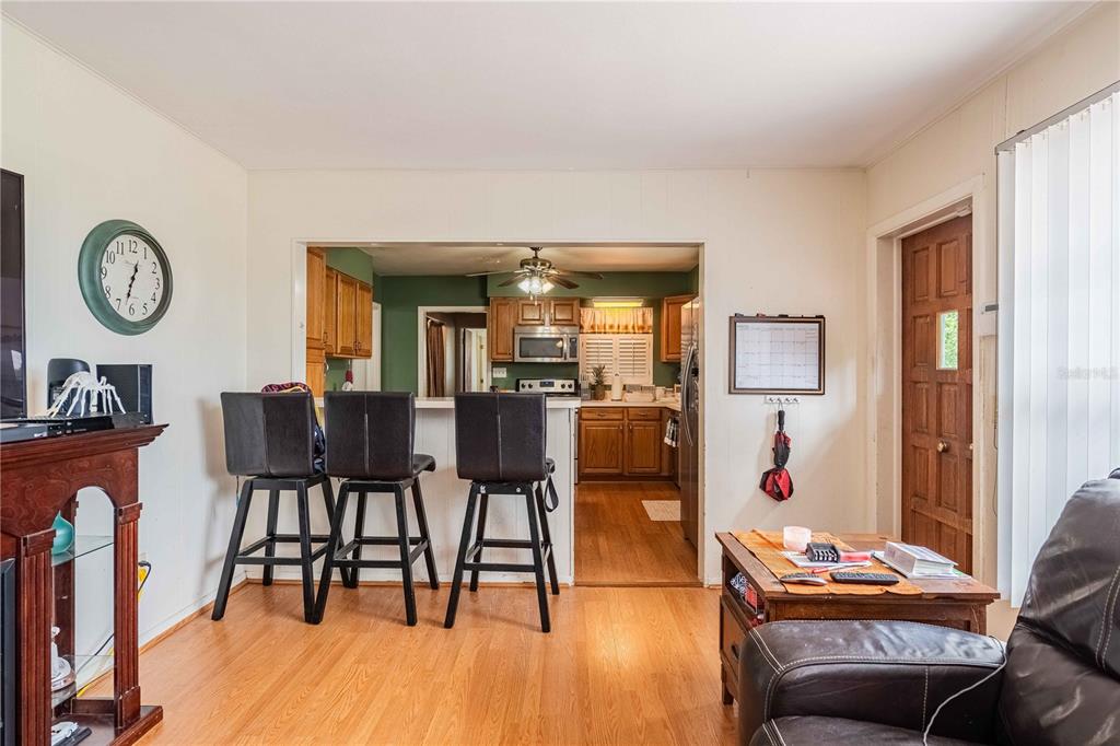 5110 Lakeland Highlands Road Lakeland, FL 33813 - Photo 10 of 40 a dining room with furniture and wooden floor