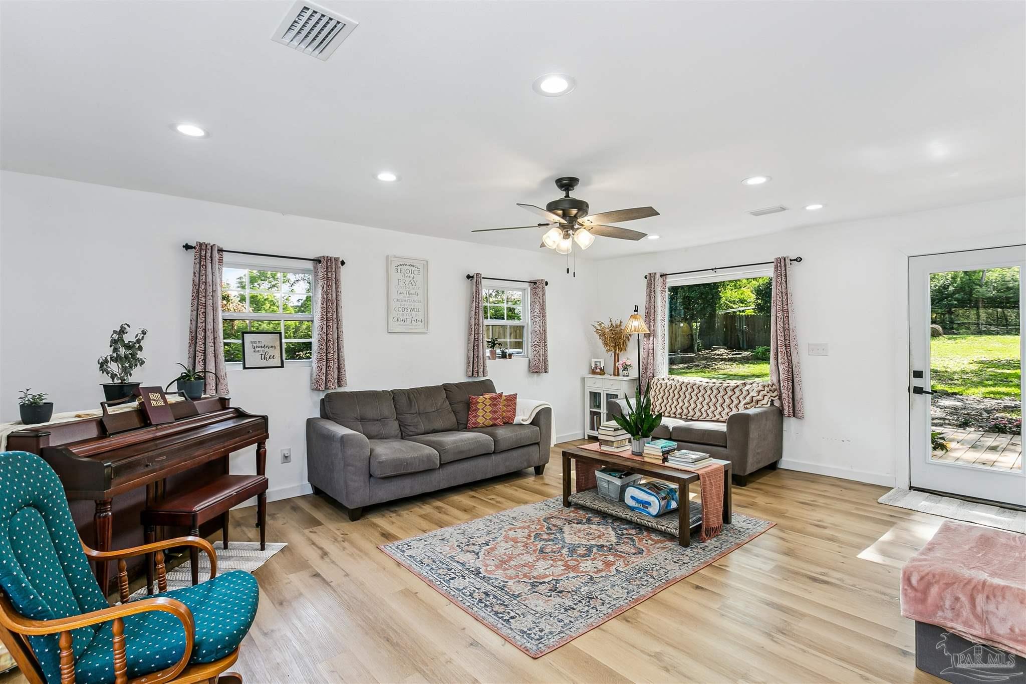 1095 River Annex Road Cantonment, FL 32533 - Photo 11 of 32 a living room with furniture and a window