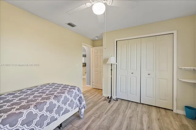a bedroom with a bed and a dresser