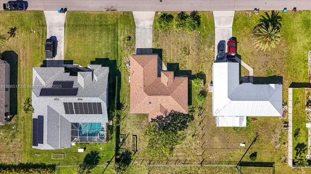 an aerial view of residential houses with outdoor space