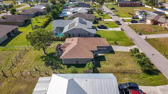 an aerial view of a house with a garden