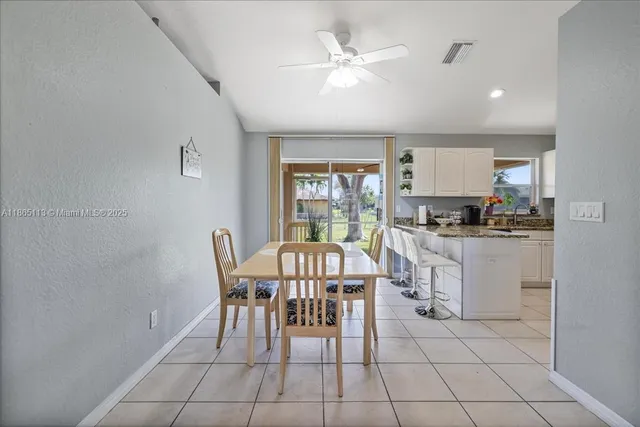 a view of kitchen with breakfast area and window