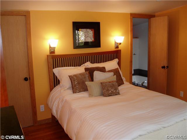 8712 Old Spring Road Richmond, VA 23235 - Photo 8 of 12 a bedroom with a bed and a window