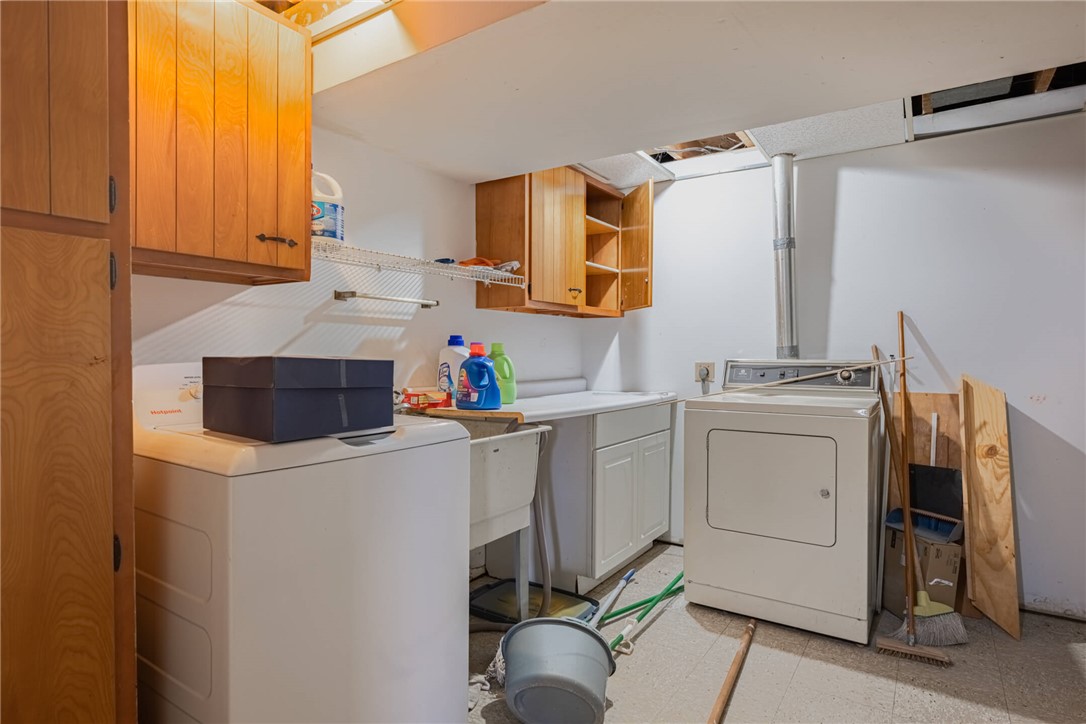 6300 Carnation Road Dayton, OH 45449 - Photo 22 of 35 This functional laundry room features convenient hookups and ample storage for everyday tasks.