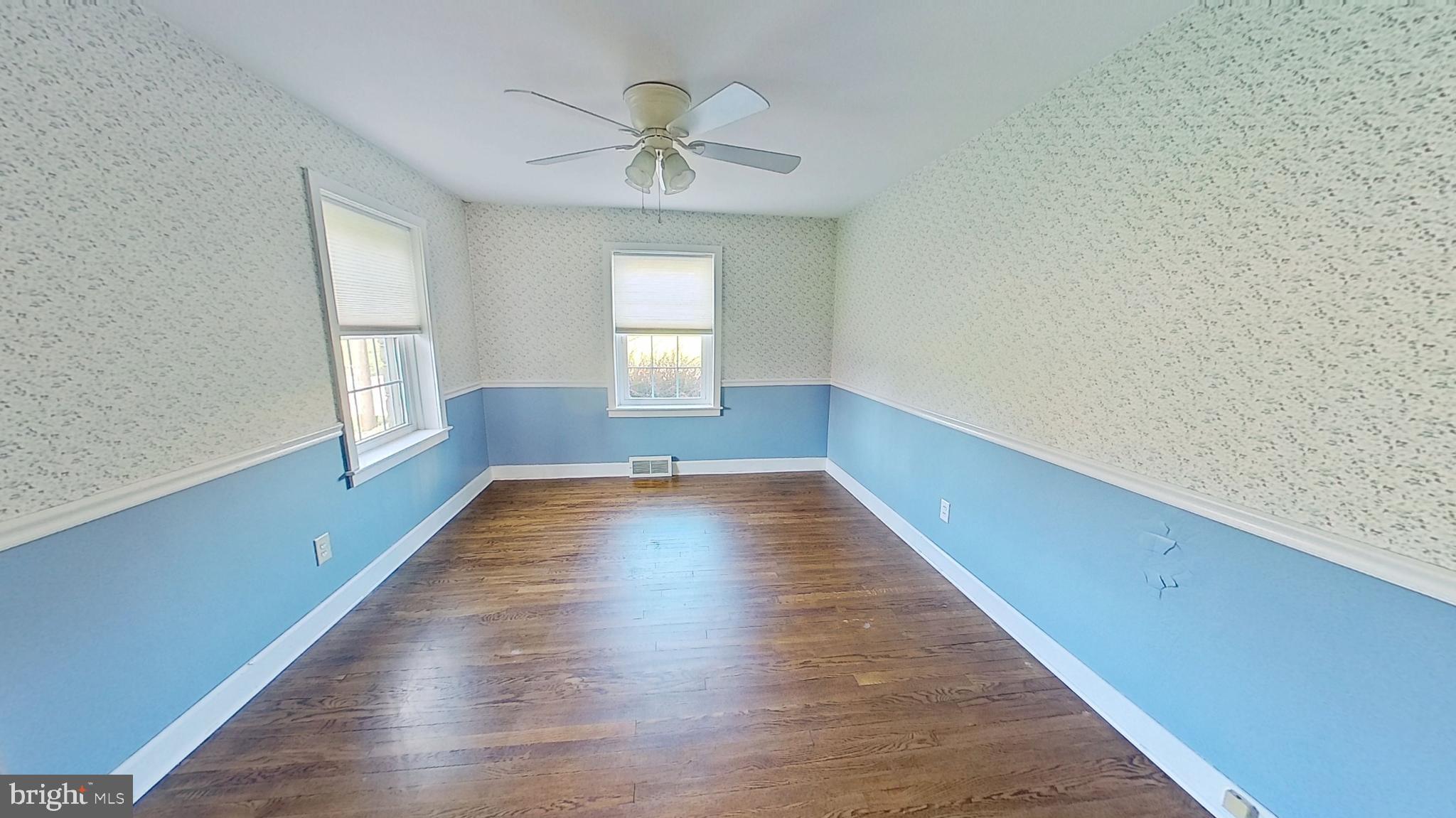 1830 Smith Station Road Spring Grove, PA 17362 - Photo 14 of 23 a view of an empty room with wooden floor and a window