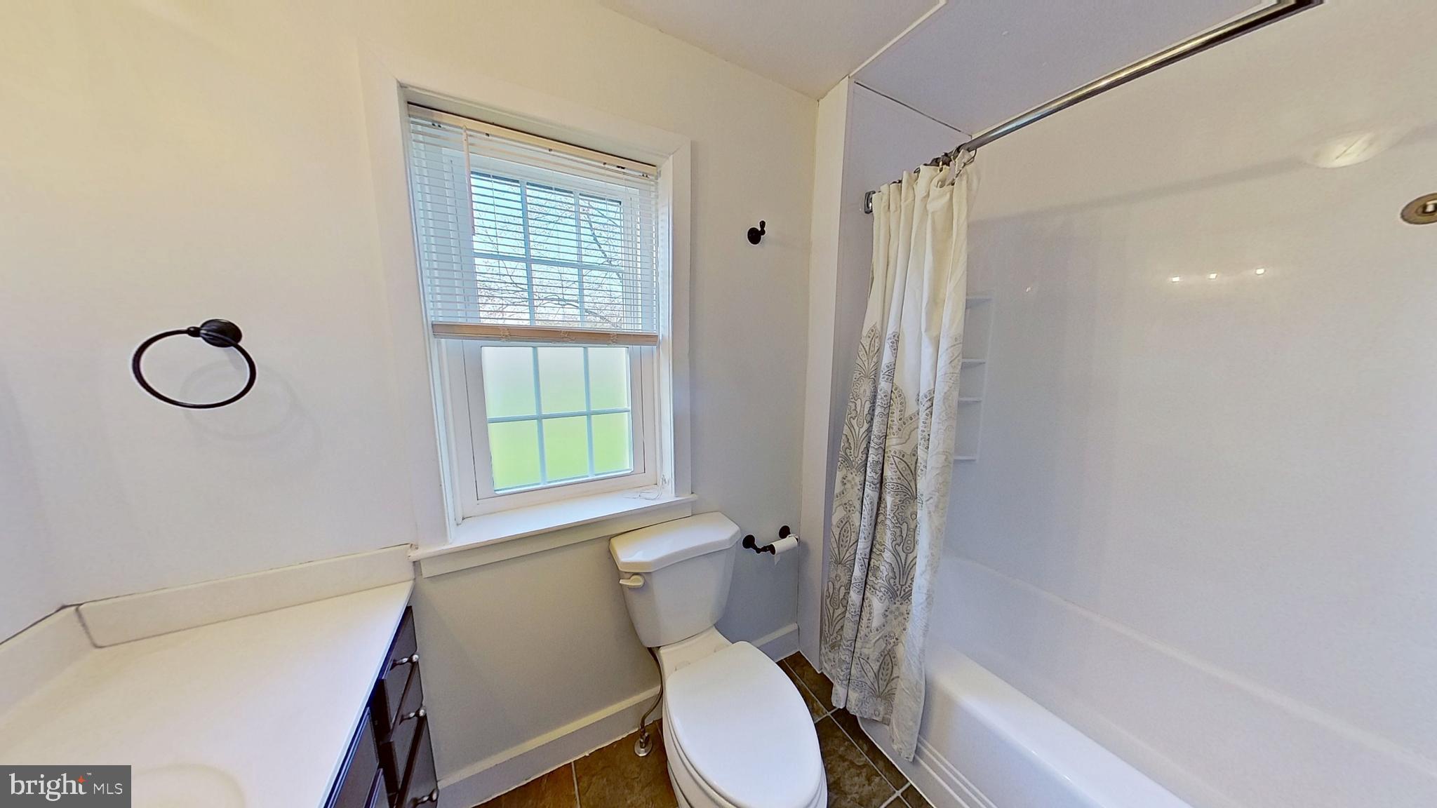 1830 Smith Station Road Spring Grove, PA 17362 - Photo 18 of 23 a white toilet sitting next to a bath tub shower