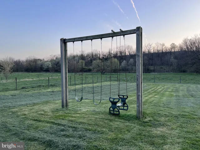a view of a bench in a field