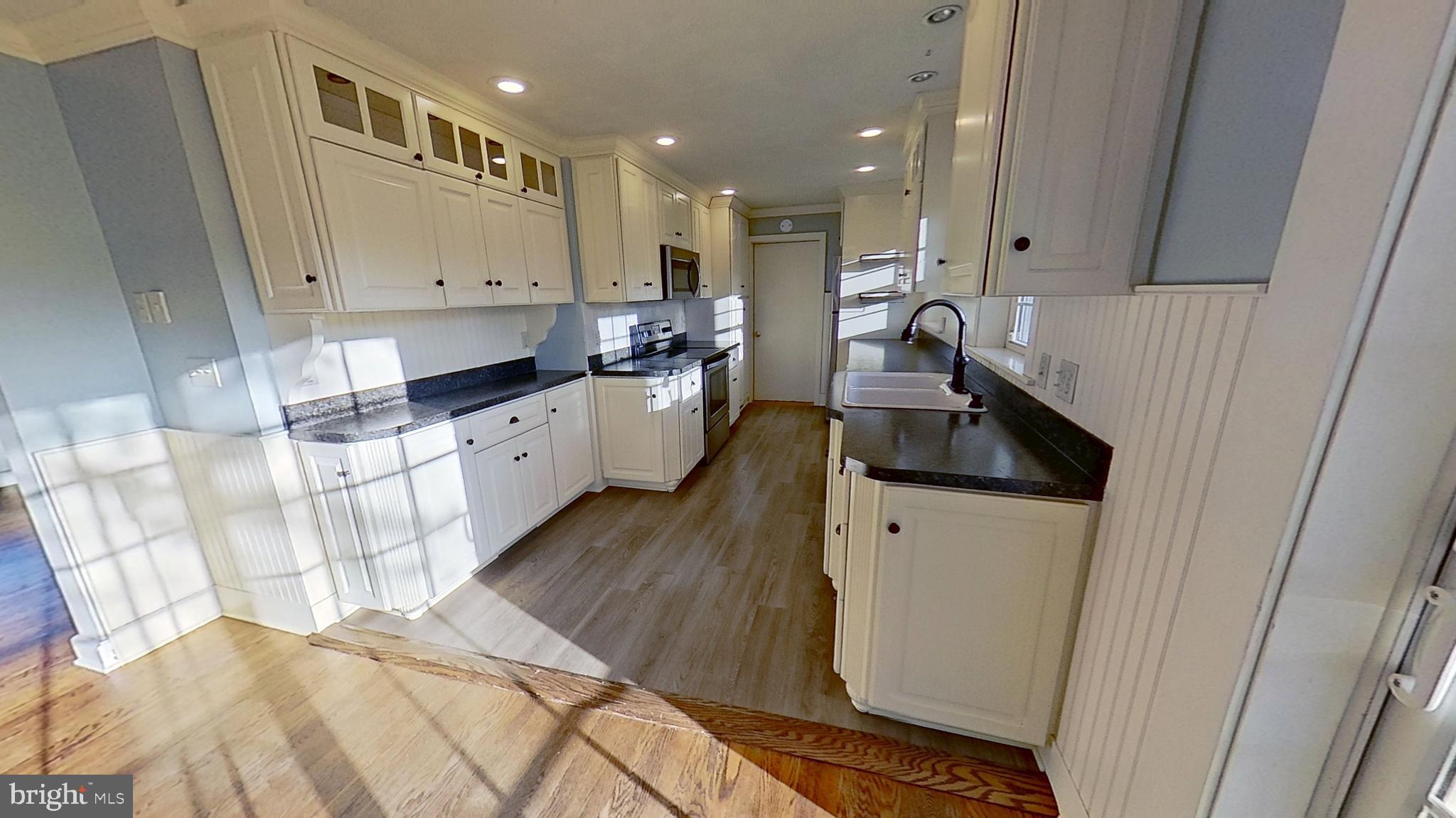 1830 Smith Station Road Spring Grove, PA 17362 - Photo 10 of 23 a kitchen with white cabinets and sink