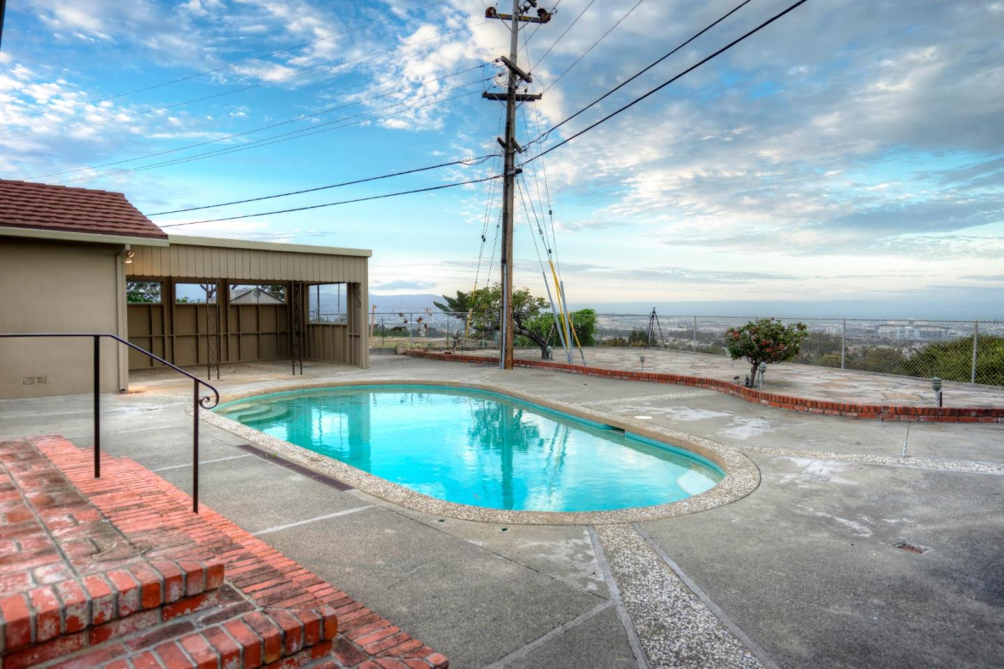 940 Ahwahnee Drive Millbrae, CA 94030 - Photo 16 of 29 a view of a swimming pool with a patio