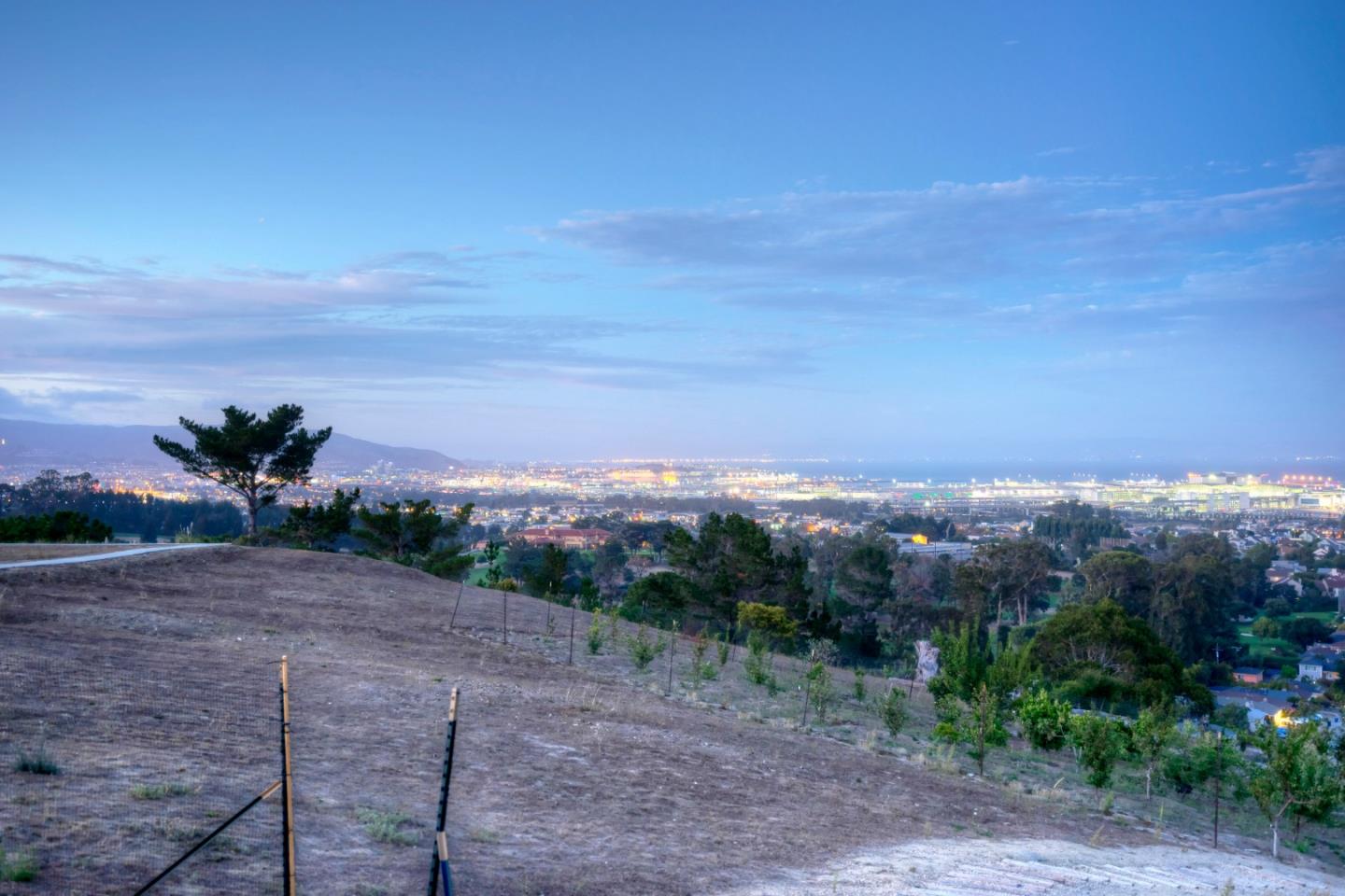 940 Ahwahnee Drive Millbrae, CA 94030 - Photo 22 of 29 a view of a dry yard with mountains in the background