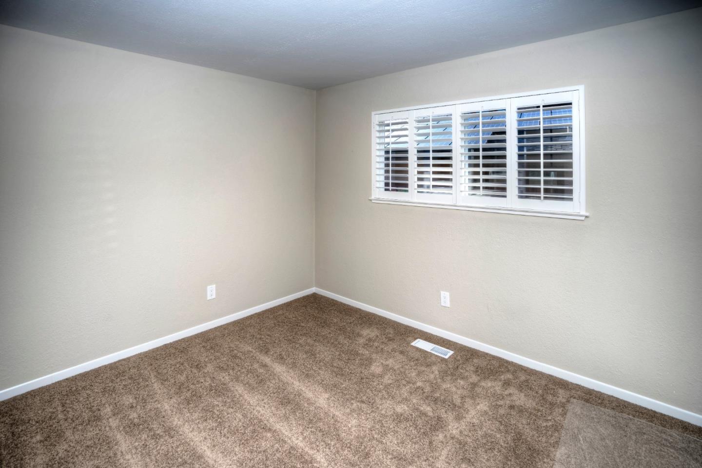 940 Ahwahnee Drive Millbrae, CA 94030 - Photo 5 of 29 an empty room with windows