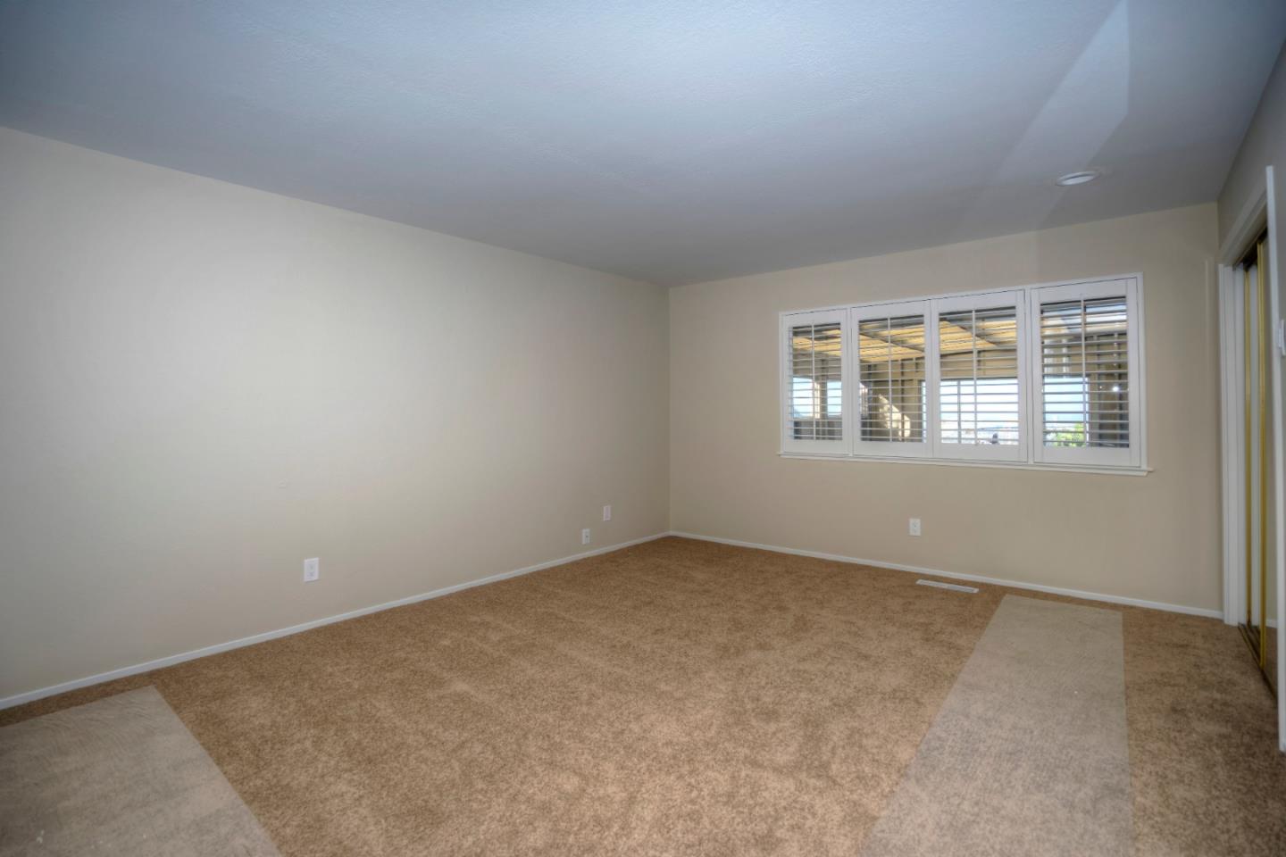 940 Ahwahnee Drive Millbrae, CA 94030 - Photo 7 of 29 an empty room with a window