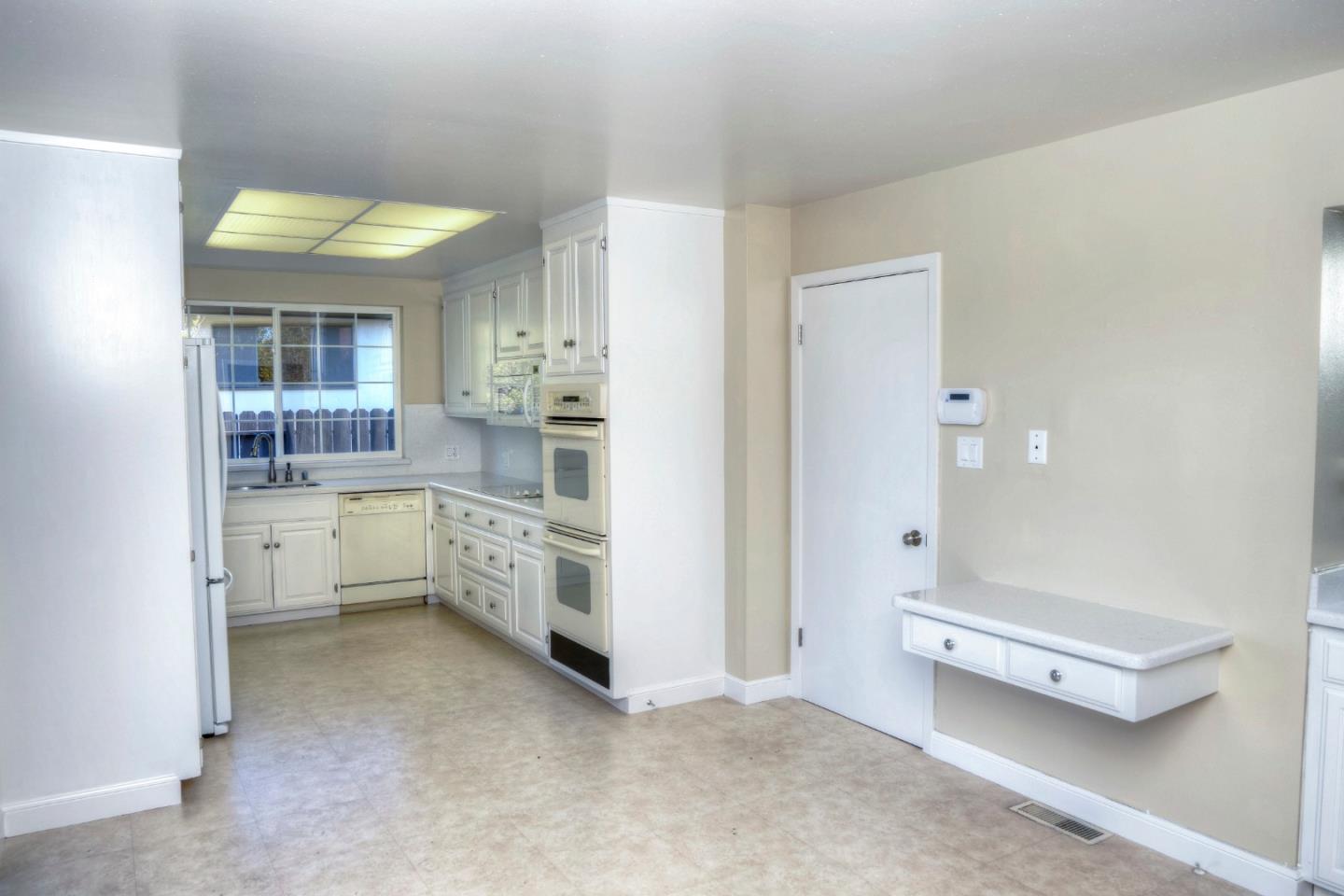 940 Ahwahnee Drive Millbrae, CA 94030 - Photo 10 of 29 a bathroom with a sink a toilet and mirror