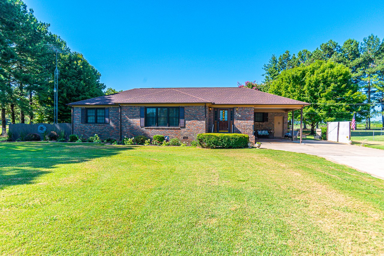 308 Jones Road Taft, TN 38488 - Photo 1 of 55 a front view of a house with swimming pool having outdoor seating