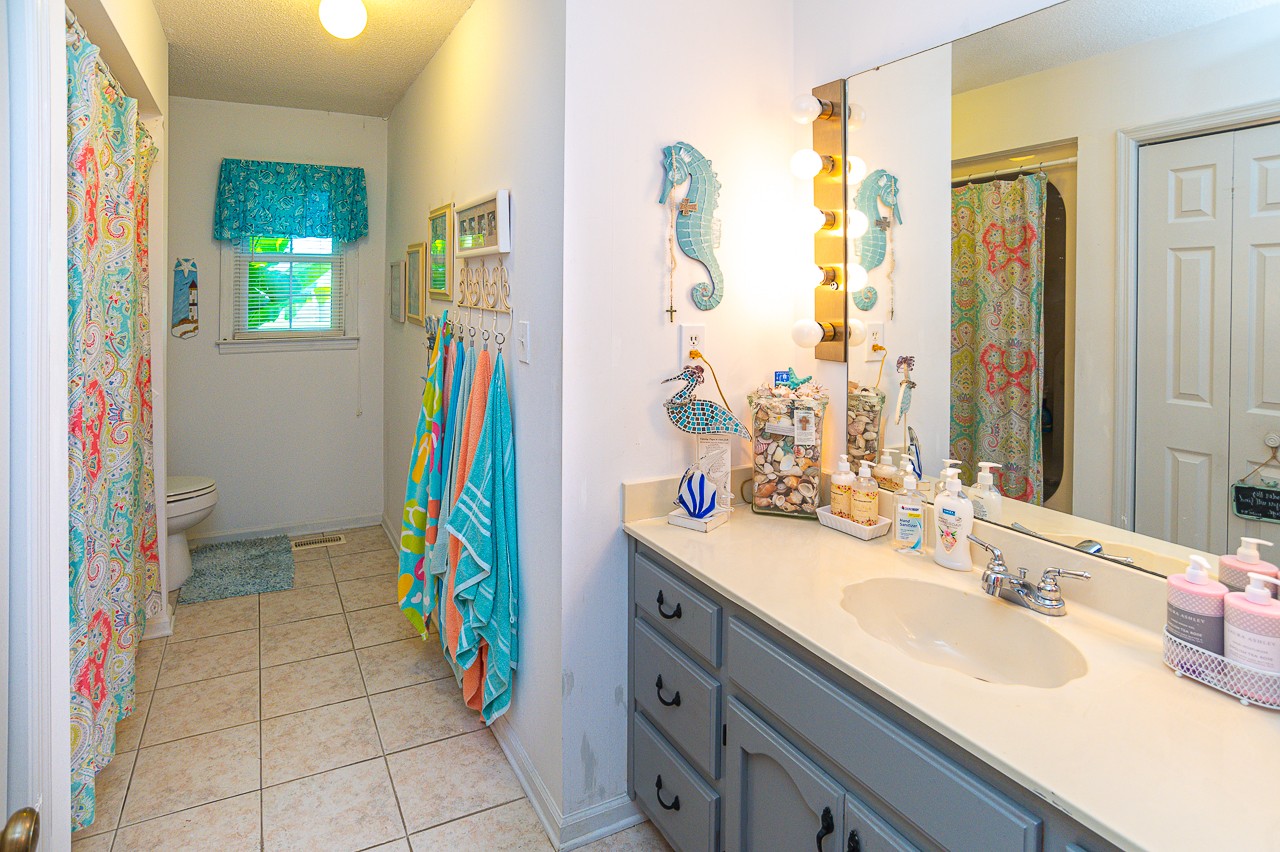 308 Jones Road Taft, TN 38488 - Photo 21 of 55 a bathroom with a sink a vanity and a mirror