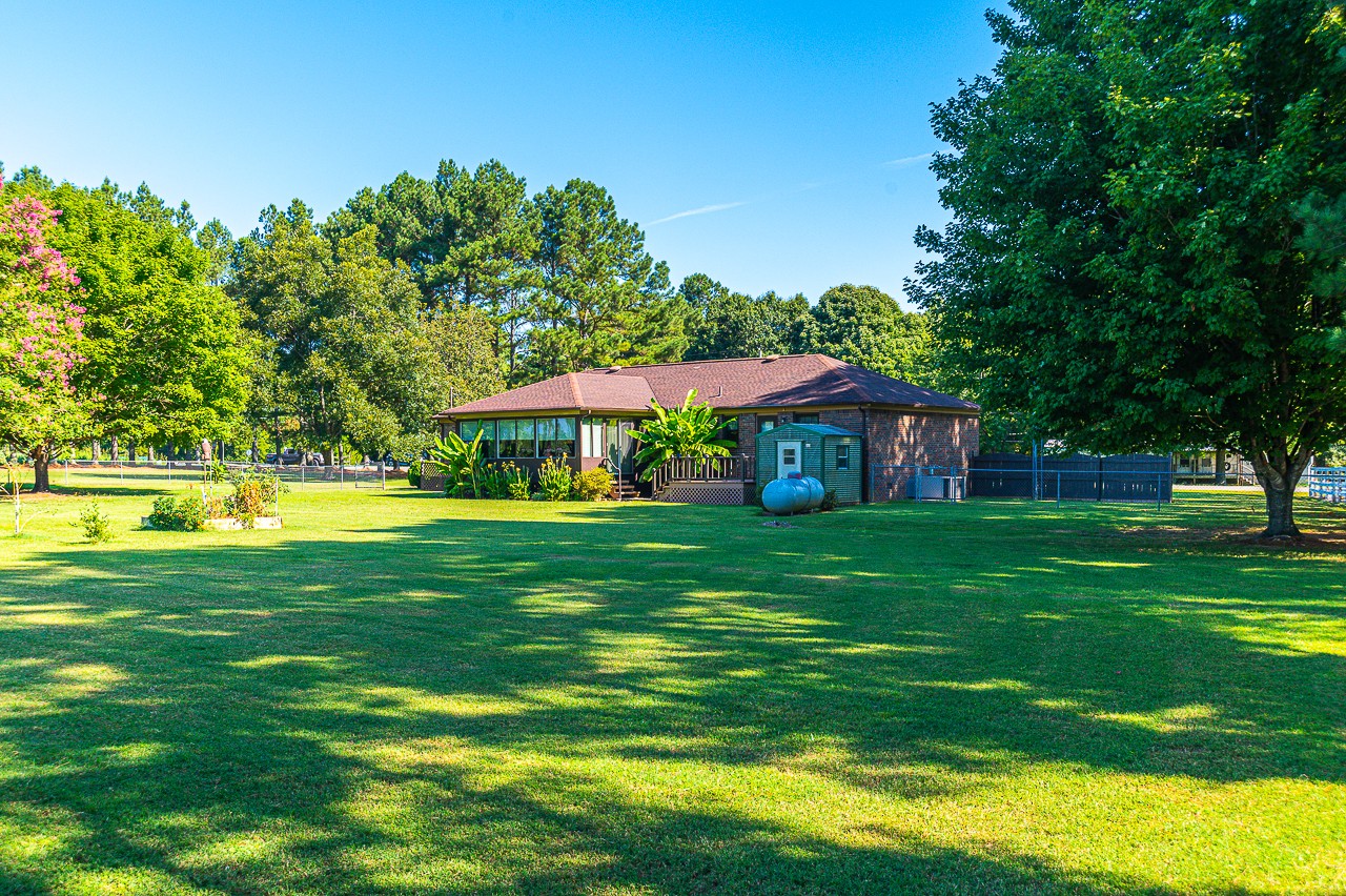 308 Jones Road Taft, TN 38488 - Photo 40 of 55 a view of a house with a yard