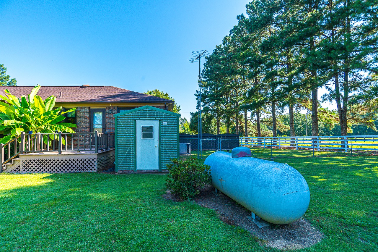308 Jones Road Taft, TN 38488 - Photo 43 of 55 a view of a house with a backyard and a slide