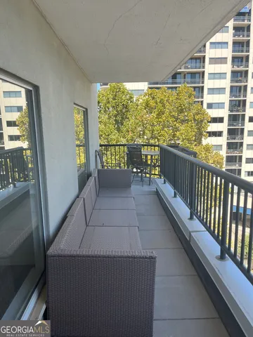 a view of balcony with a potted plant