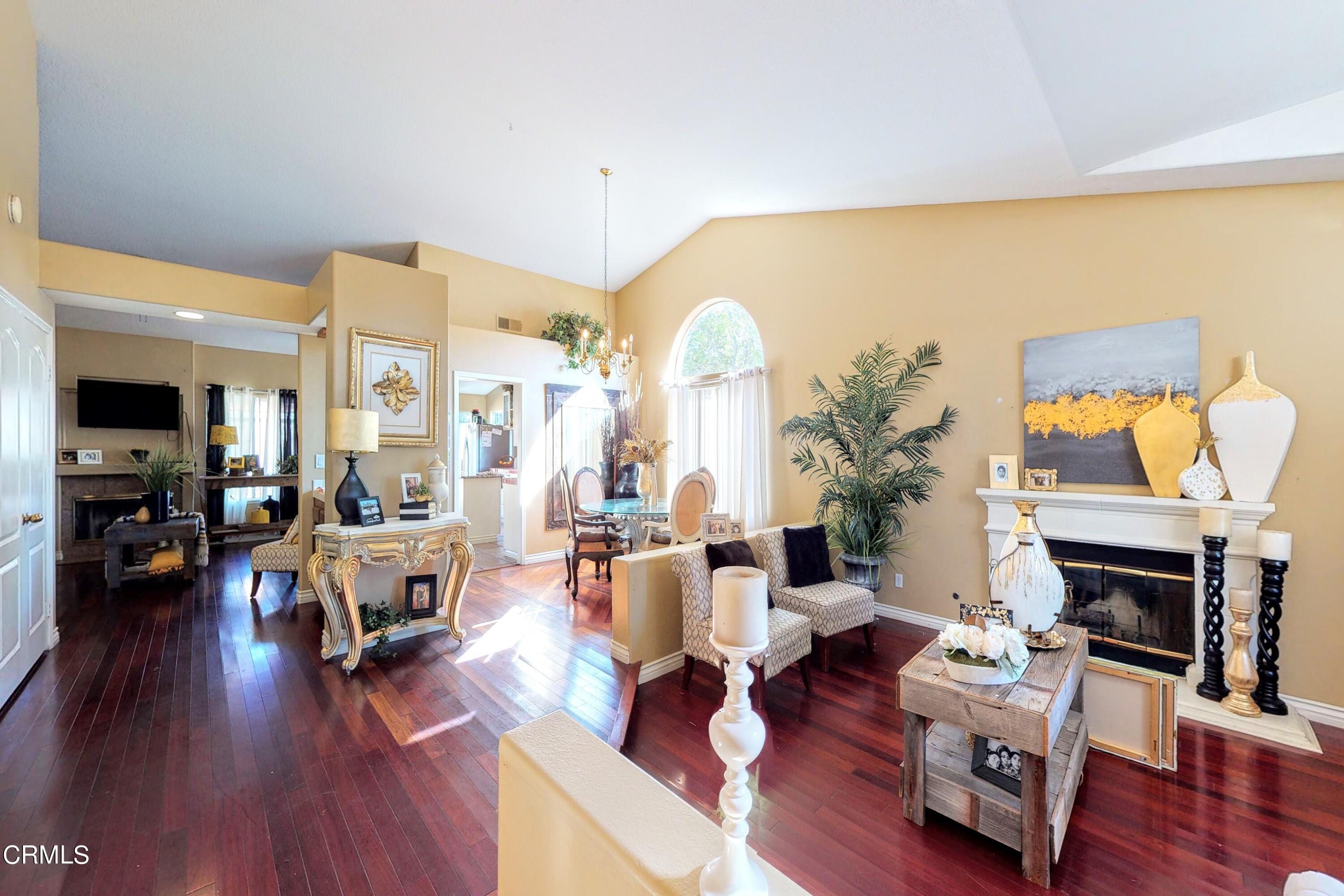 2400 Hillrose Place Oxnard, CA 93036 - Photo 3 of 13 a living room with furniture fireplace and wooden floor