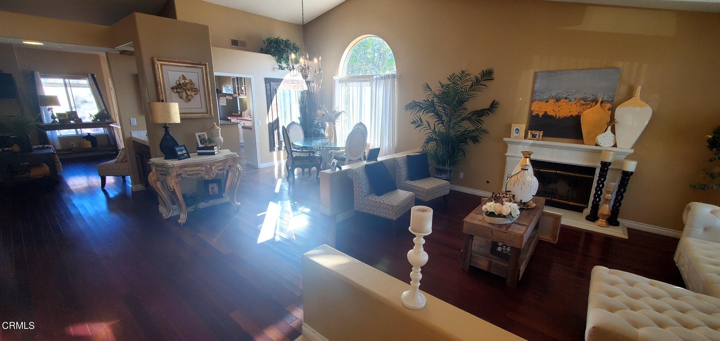 2400 Hillrose Place Oxnard, CA 93036 - Photo 5 of 13 a living room with fireplace furniture and a wooden floor