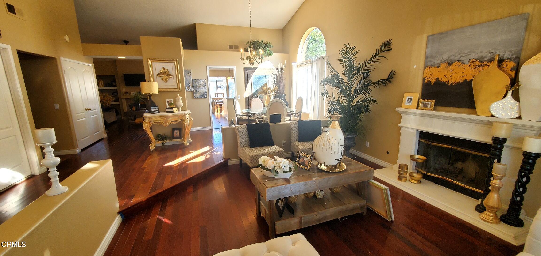 2400 Hillrose Place Oxnard, CA 93036 - Photo 6 of 13 a living room with furniture fireplace and flat screen tv