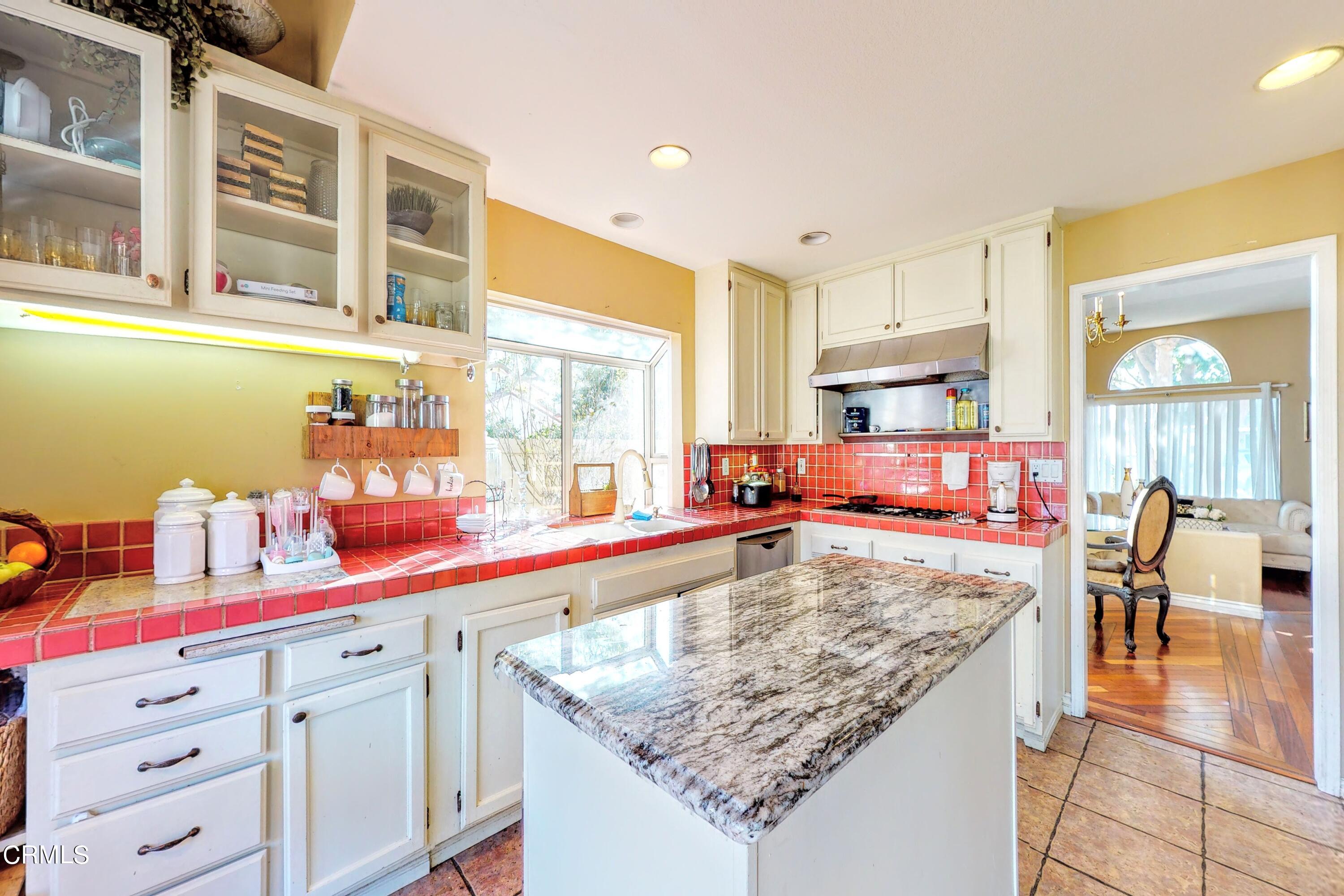 2400 Hillrose Place Oxnard, CA 93036 - Photo 9 of 13 a kitchen with stainless steel appliances granite countertop a stove and a sink