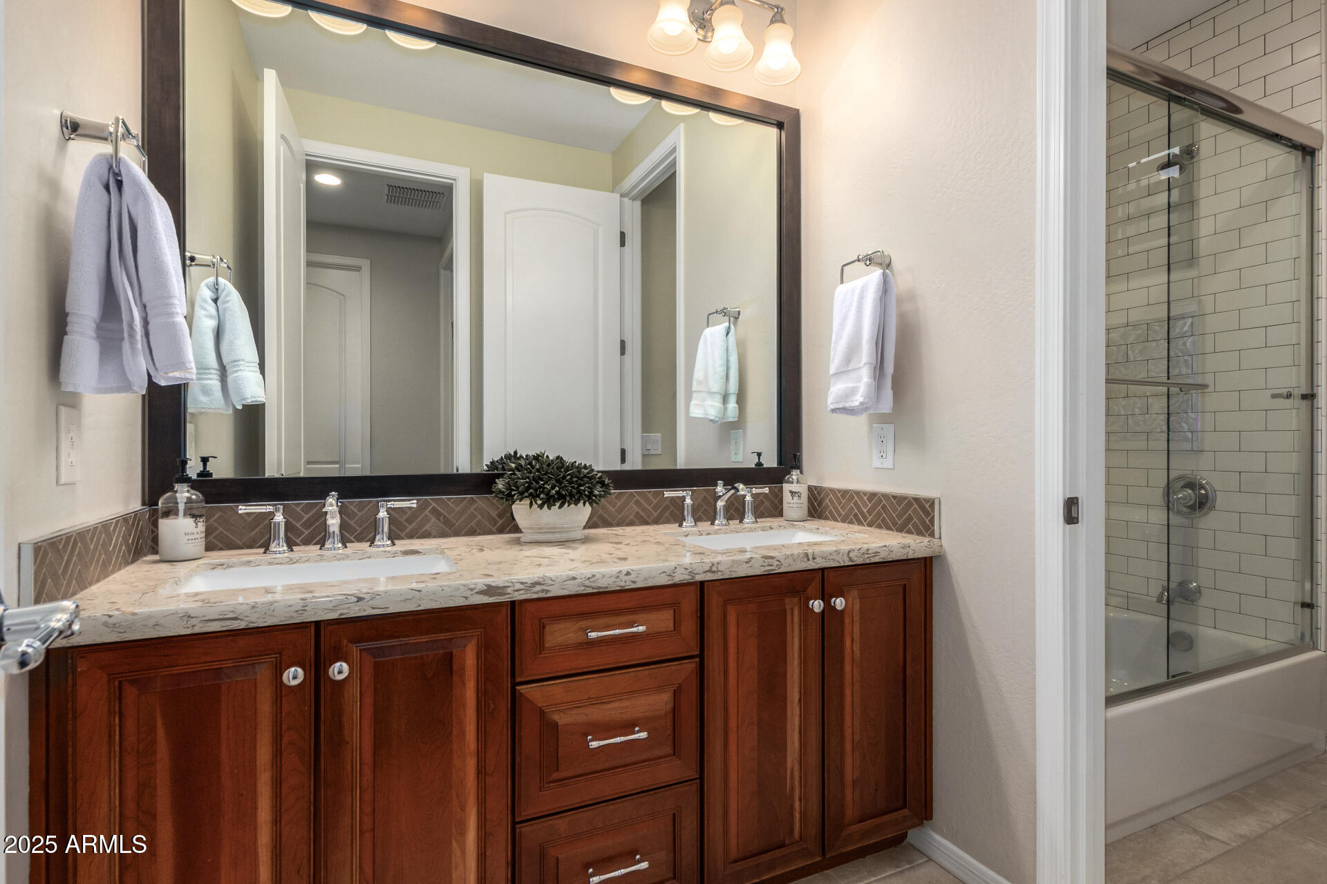 21626 North 38th Way Phoenix, AZ 85050 - Photo 28 of 72 a bathroom with a double vanity sink and a mirror