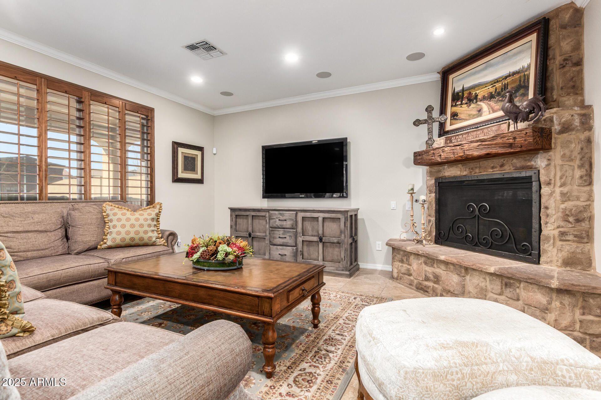21626 North 38th Way Phoenix, AZ 85050 - Photo 5 of 72 a living room with furniture a fireplace and a flat screen tv