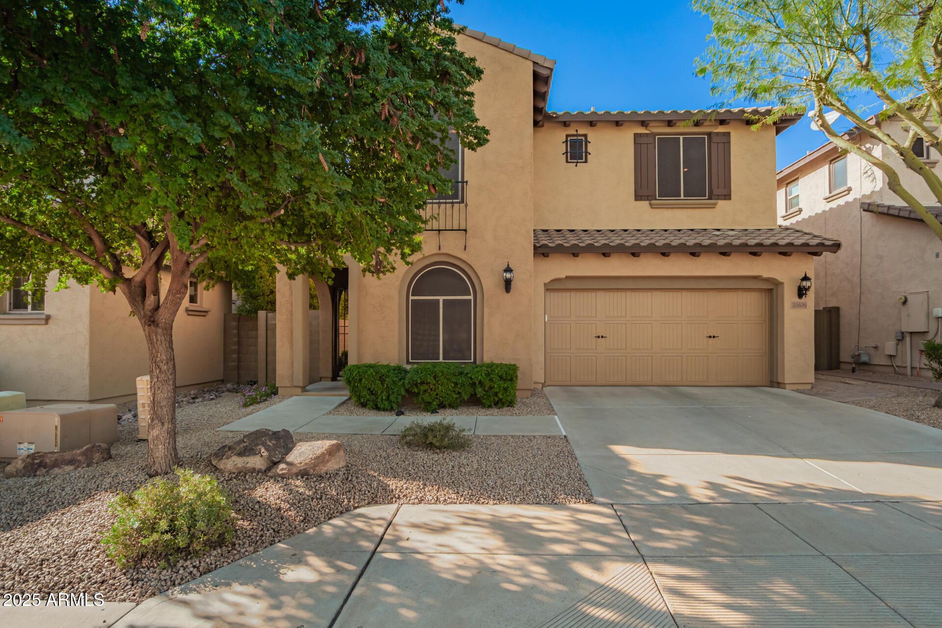 21626 North 38th Way Phoenix, AZ 85050 - Photo 68 of 72 a view of a white house with a sink and large tree