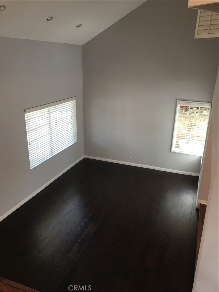 29022 Modjeska Peak Lane Lake Forest, CA 92679 - Photo 13 of 36 an empty room with wooden floor and windows