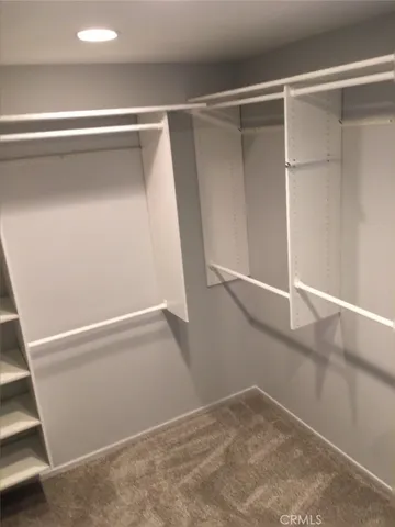 a view of an empty walk in closet