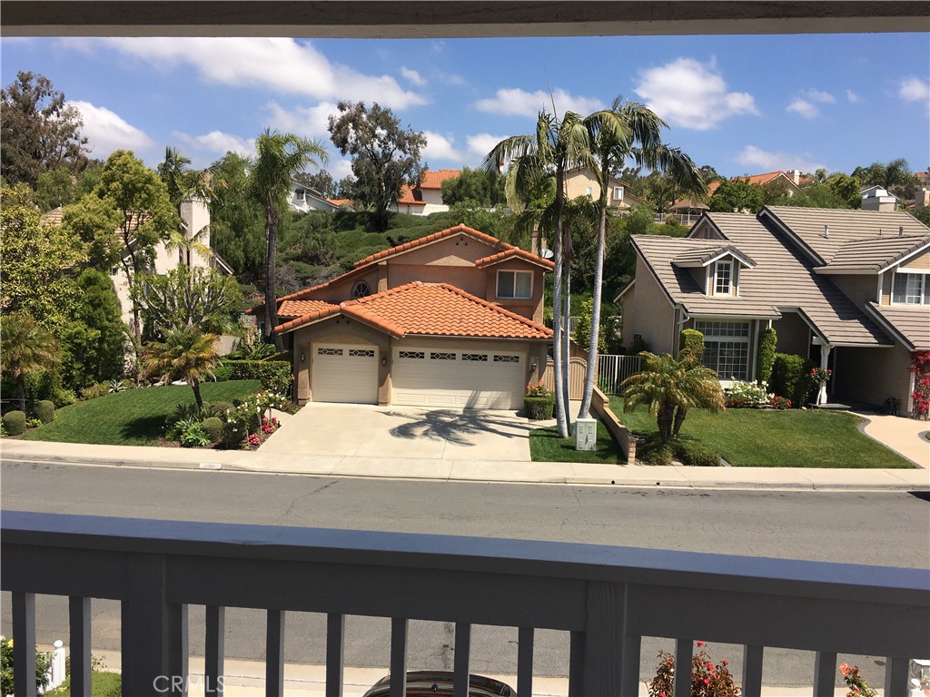 29022 Modjeska Peak Lane Lake Forest, CA 92679 - Photo 25 of 36 a front view of a house with a yard and potted plants