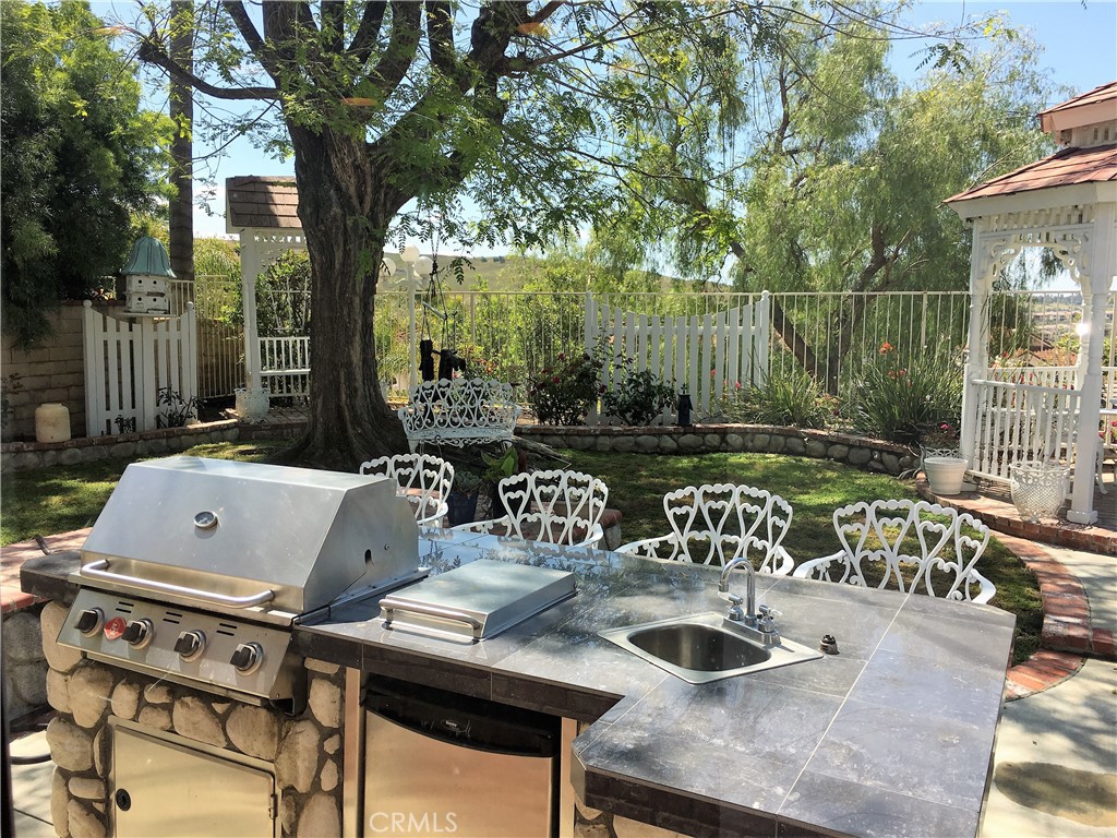 29022 Modjeska Peak Lane Lake Forest, CA 92679 - Photo 30 of 36 a view of backyard with deck and outdoor seating