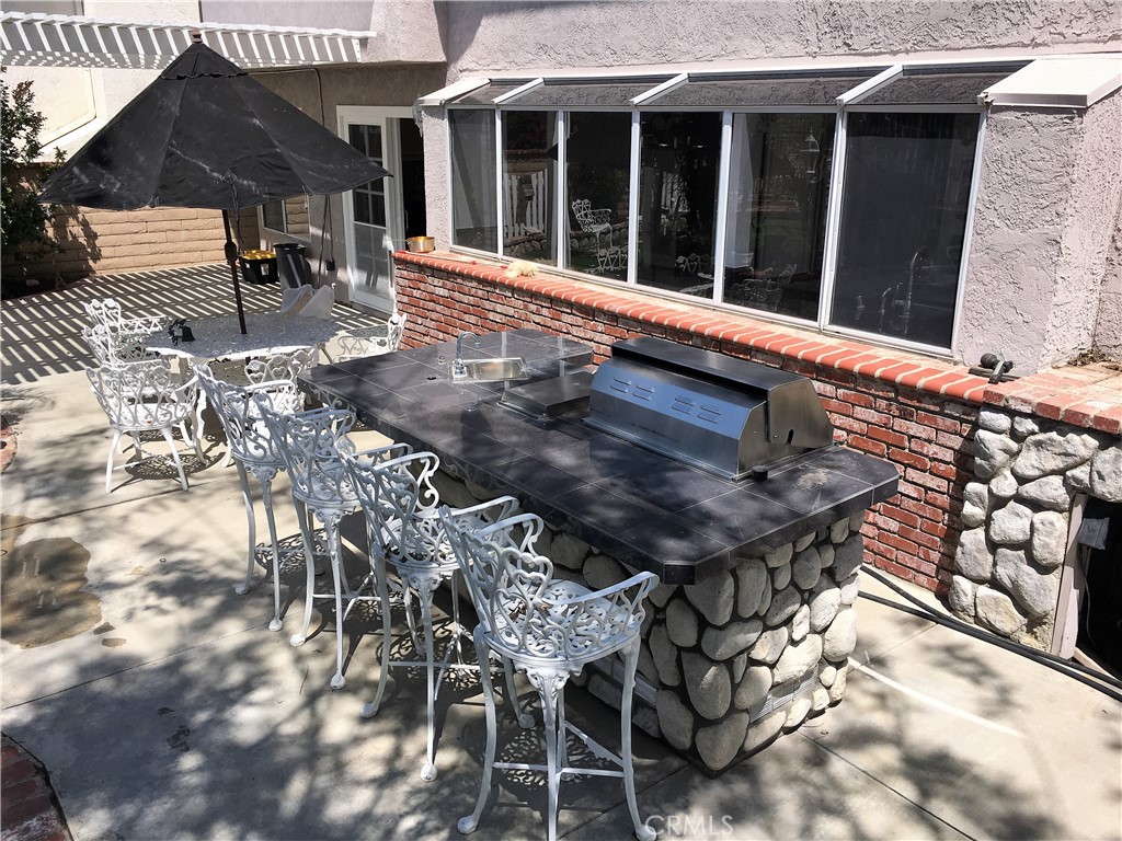 29022 Modjeska Peak Lane Lake Forest, CA 92679 - Photo 31 of 36 a roof deck with table and chairs and potted plants
