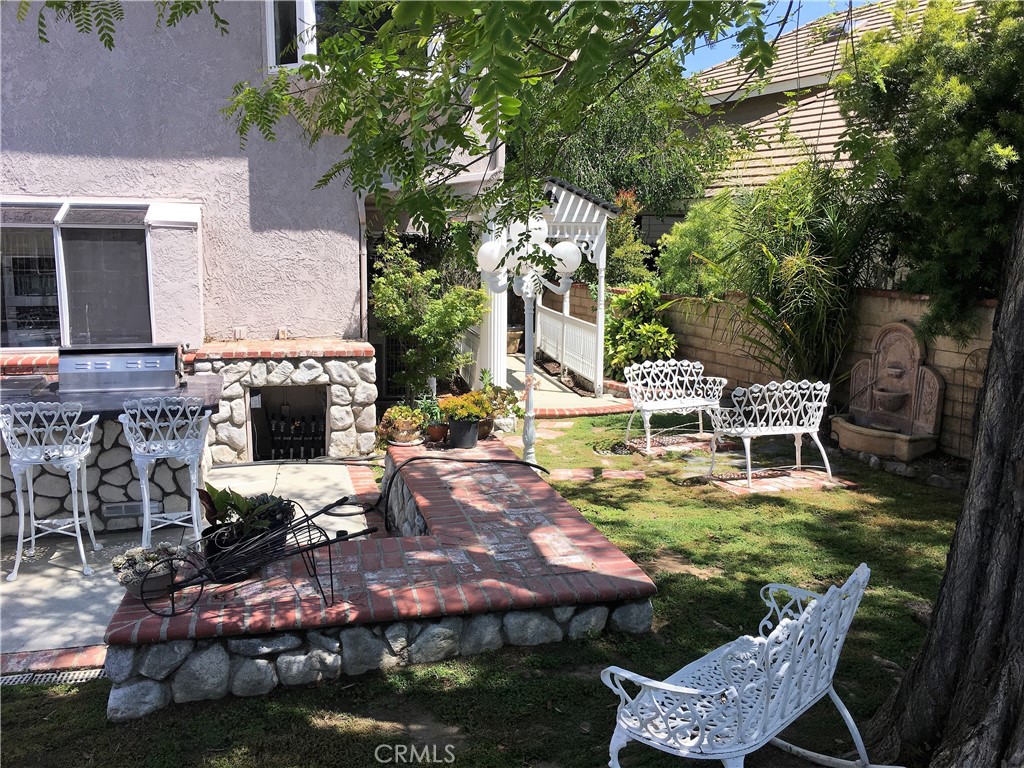 29022 Modjeska Peak Lane Lake Forest, CA 92679 - Photo 33 of 36 a view of an chairs and table in backyard